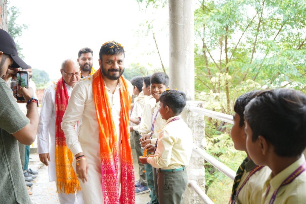 Dr. Dilip Pal welcomed by school children